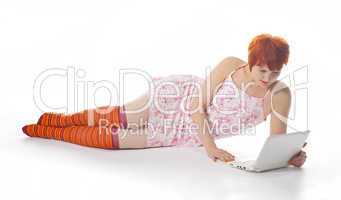 Red Girl in stripe socks  with laptop on white background