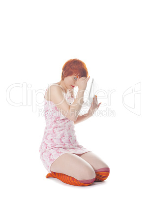 Red Girl in stripe socks  with laptop on white background