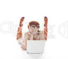 Red Girl in stripe socks  with laptop on white background