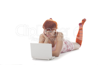 Red Girl in stripe socks  with laptop on white background