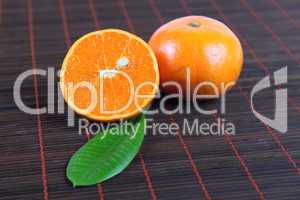 Two tangerines on a bamboo napkin