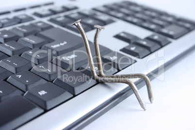 Two nails sitting on the keyboard