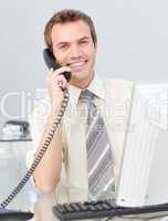 Businessman talking on phone in the office