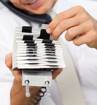 Close-up of a businessman holding a card holder