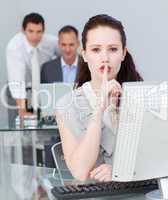 Businesswoman asking for silence in the office