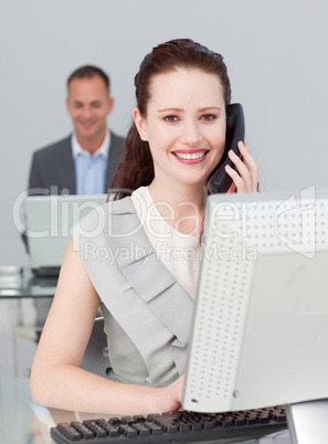 Businesswoman on phone and working in the office
