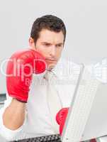 Businessman boxing himself in the face