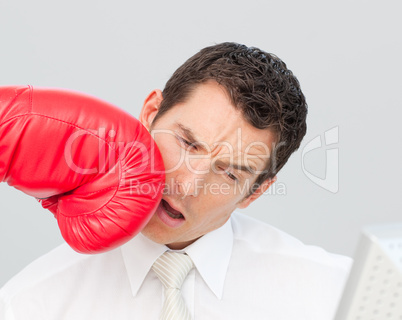 Boxing a businessman in his face