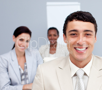 Portrait of a businessman smiling in a meeting