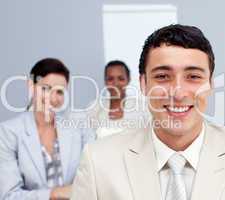 Portrait of a businessman smiling in a meeting