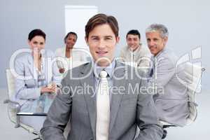 Attractive businessman smiling in a meeting