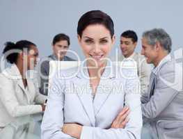 Close-up of happy businesswoman smiling in a meeting