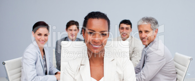 Afro-American businesswoman smiling in a meeting