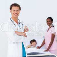 Confident pediatrician and nurse attending to a child