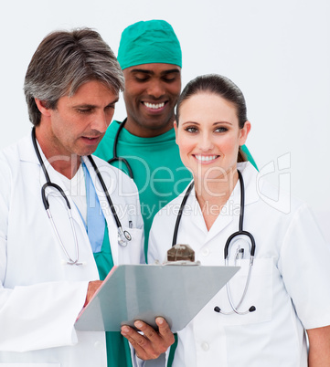 Portrait of medical team taking notes