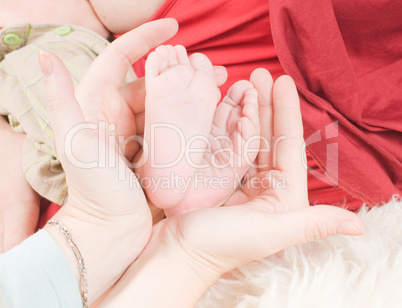Newborn child and hands