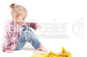 Toddler with maple leaves