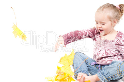 Toddler with maple leaves