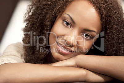 Beautiful Mixed Race African American Girl Resting On Her Hands