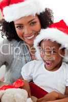 Mother and daughter having fun at Christmas time