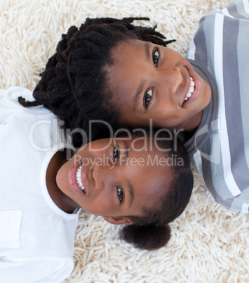 Portrait of Afro-American brother and sister on floor