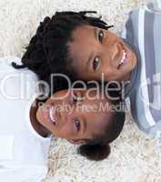Portrait of Afro-American brother and sister on floor