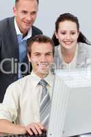 Businessman working with his colleagues with a computer