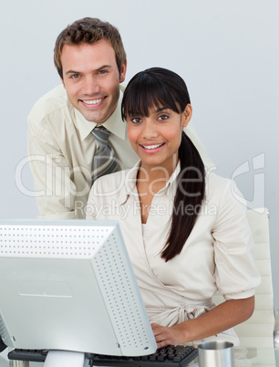 Business colleagues using a laptop