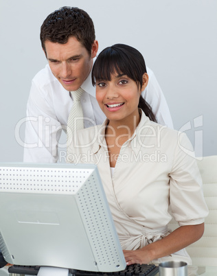 Smiling Afro-American businesswoman with her colleague in the of