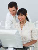 Businessman and Afro-American businesswoman in the office