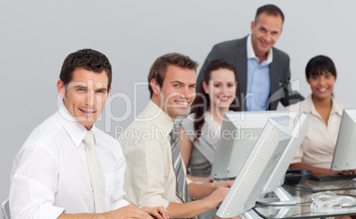 Multi-ethnic business team working with computers in an office
