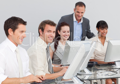 Multi-ethnic business people working with computers in an office