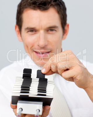 Attractive businessman holding a card holder