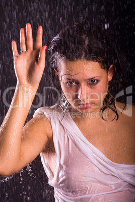 young girl under rain