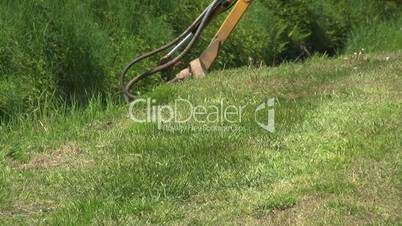 Tractor Cutting Grass In Ditch