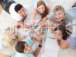 Teenagers studying Science on the floor