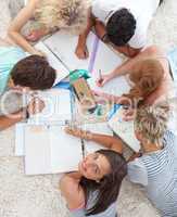 High angle of teenagers studying together