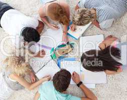 High angle of teenagers studying together