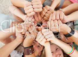 Teenagers on the floor with thumbs up