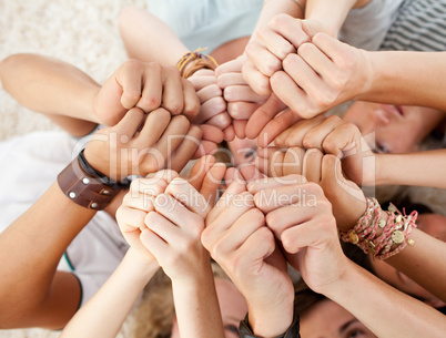 Friends on the floor with thumbs up