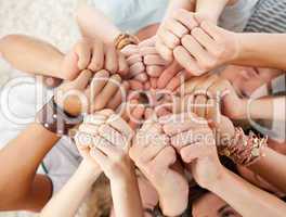 Friends on the floor with thumbs up