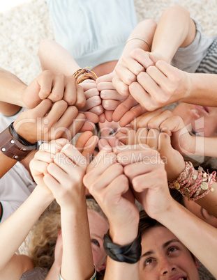 Teenagers on the floor with thumbs up