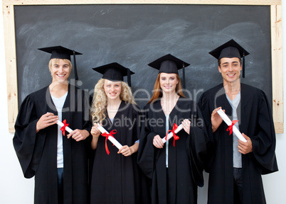 Group of adolescents celebrating after Graduation