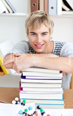 Tired teeenager sleeping in a library