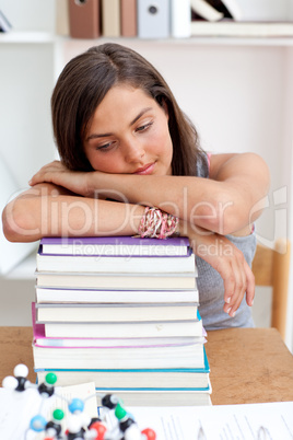 Tired teeenager sleeping in a library