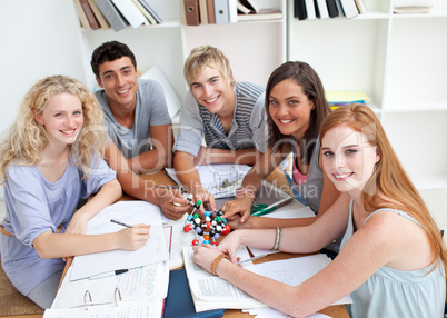 High angle of teenagers studying Science in a library