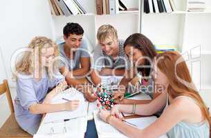 Teenagers studying Science in a library