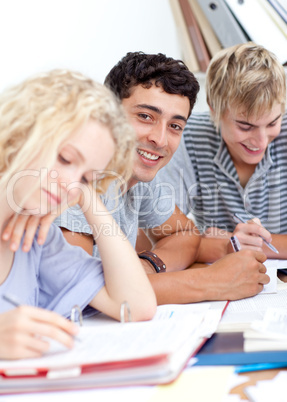 Teen guy studying in the library