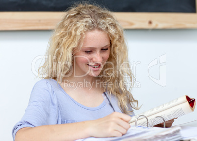Smiling teenage girl  studying