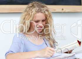 Smiling teenage girl  studying